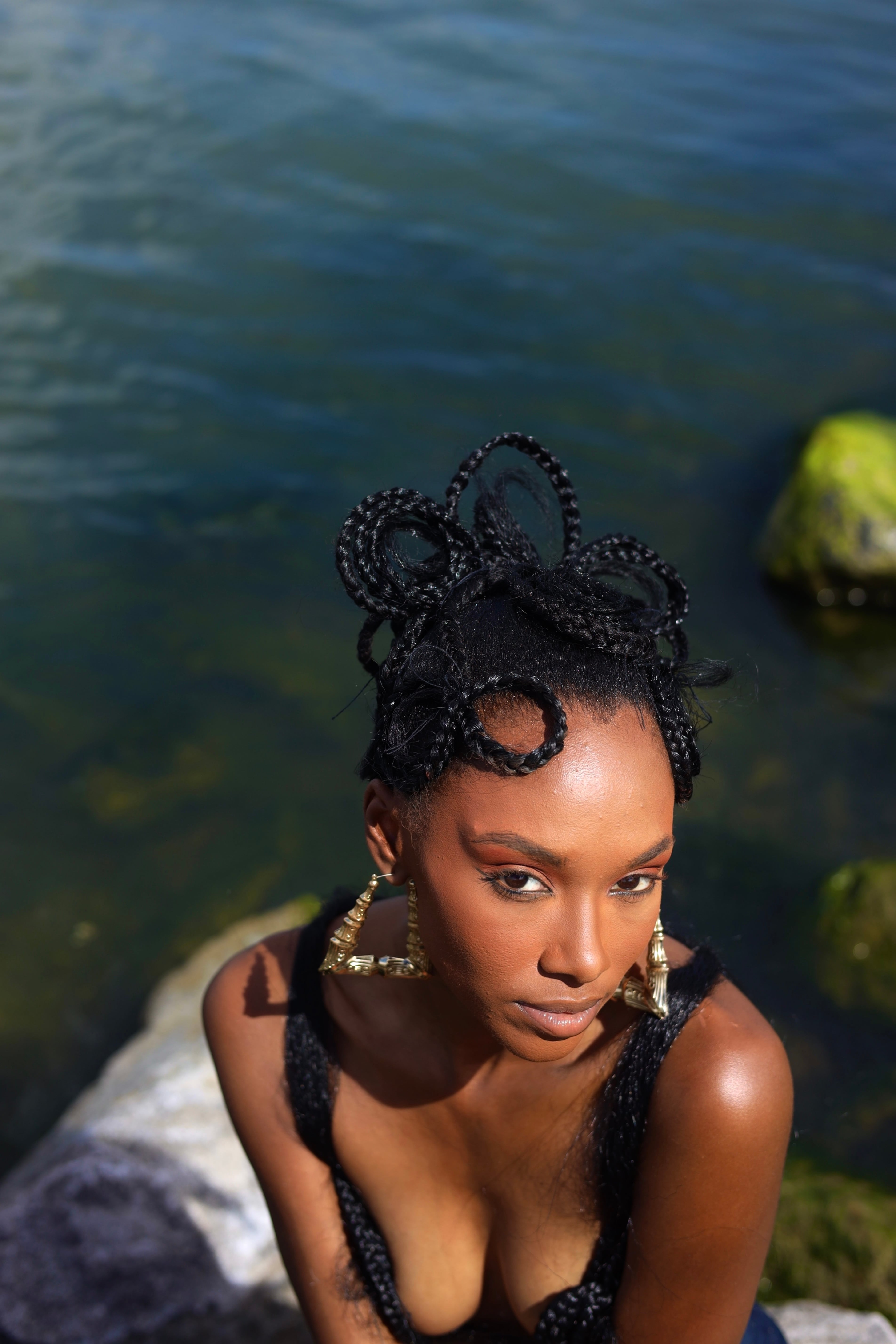 Color portrait — top-down, sculptural updo