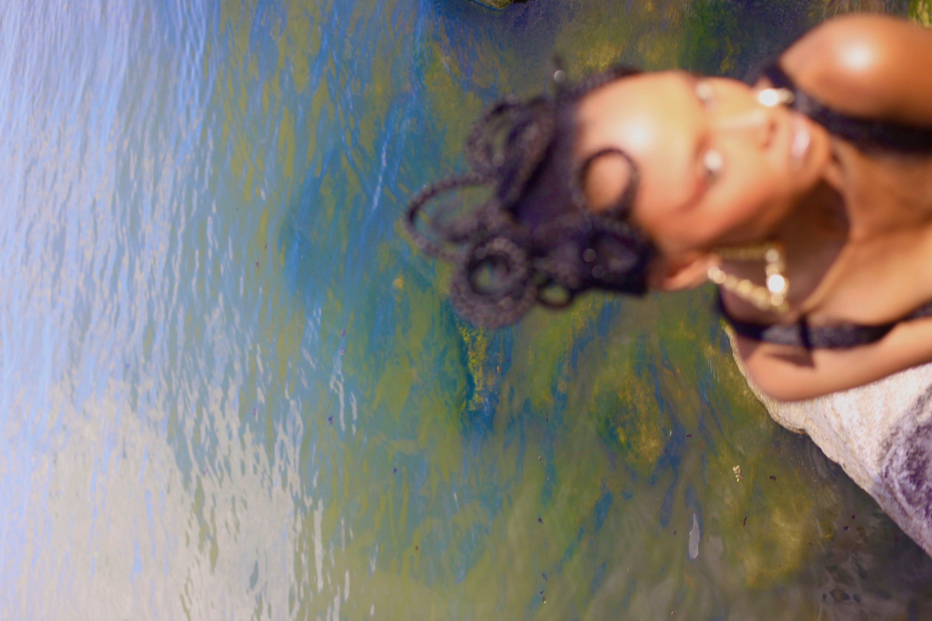 Sculptural braided updo at the water's edge — Moodhouse